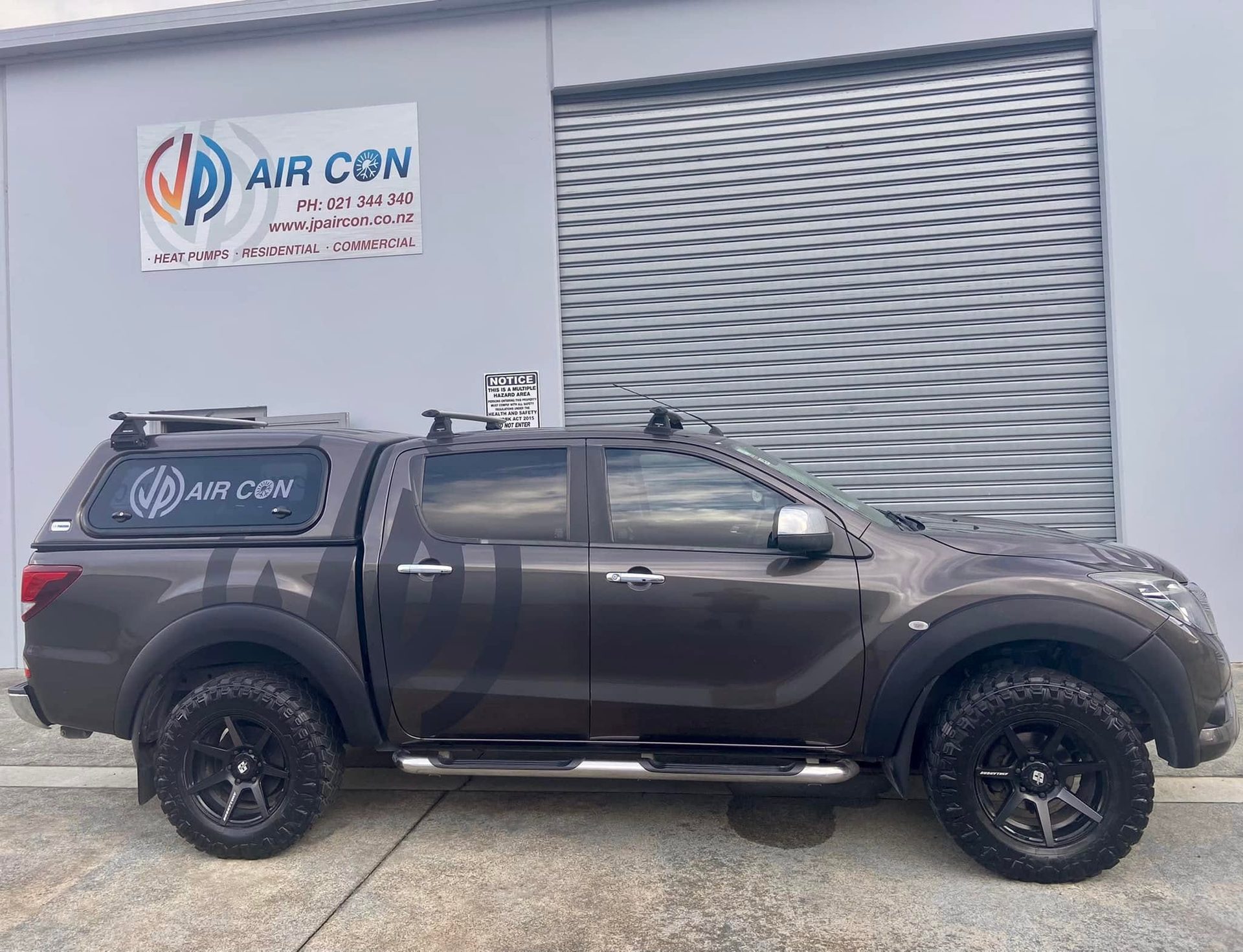JP Aircon branded ute with canopy and company signage