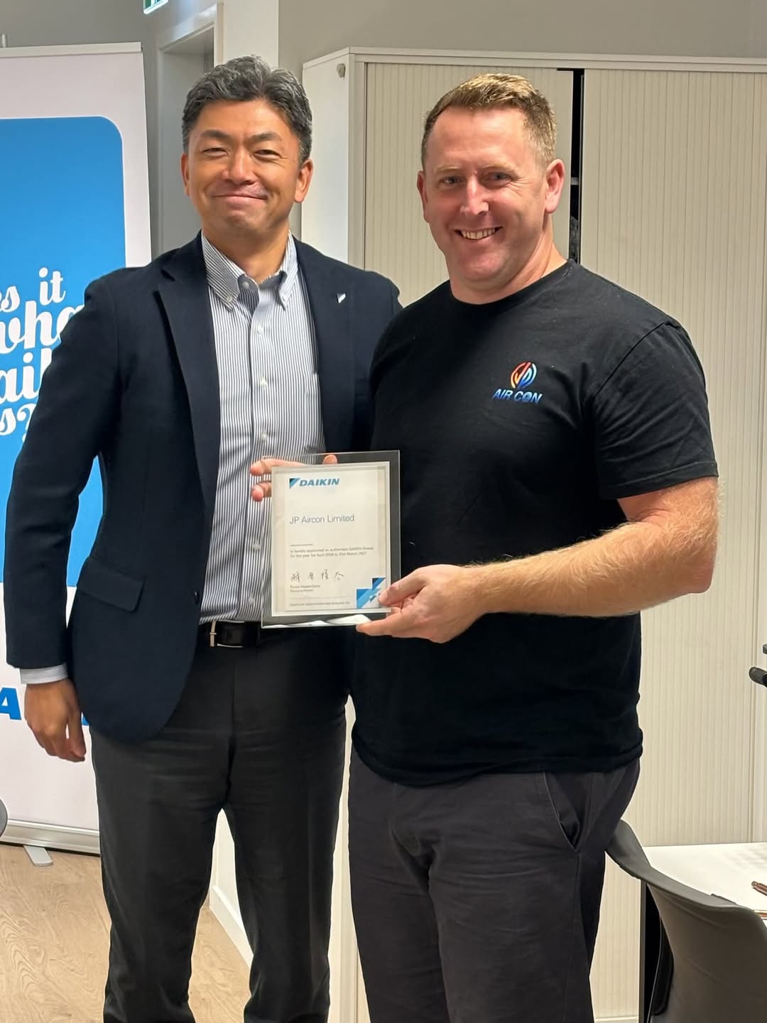 JP Aircon receiving a dealer recognition certificate